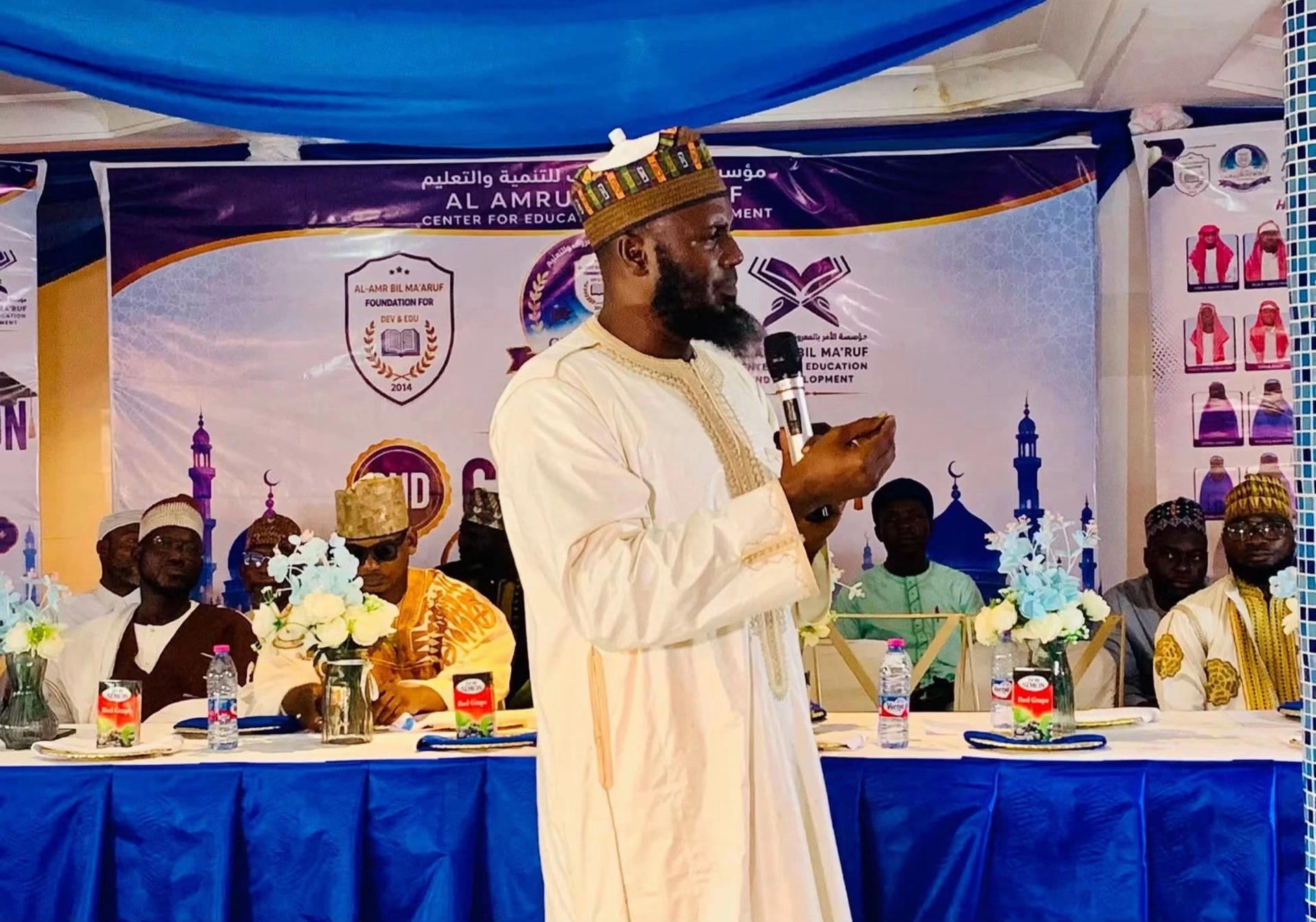 Al Amru Bil Ma'ruf banner at the graduation ceremony